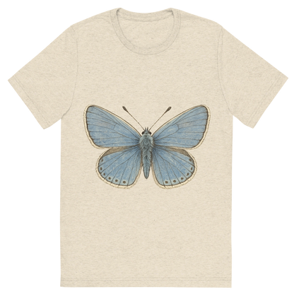 Front view of a Premium Tri-Blend Crew Neck T-Shirt in Oatmeal showing 'A hand-drawn, tranquil graphic of common blue butterfly'