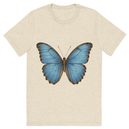 Front view of a Premium Tri-Blend Crew Neck T-Shirt in Oatmeal showing 'A hand-drawn, tranquil graphic of blue morpho butterfly'