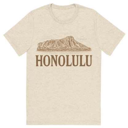 Front view of a Premium Tri-Blend Crew Neck T-Shirt in Oatmeal showing 'A typographic, nostalgic graphic of a typographic illustration of the words 'honolulu' with a vintage line art drawing of the diamond head crater'