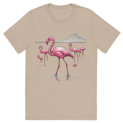 Front view of a Premium Tri-Blend Crew Neck T-Shirt in Tan showing 'A hand-drawn ink with color pops, elegant graphic of a graceful group of pink flamingos wading through the shallow, reflective waters of lake natron, illustrated in a hand-drawn ink style with pops of vivid pink and white, centered composition, transparent background, optimized for dtg printing'