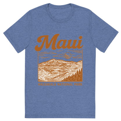 Front view of a Premium Tri-Blend Crew Neck T-Shirt in Blue showing 'A typographic, nostalgic graphic of a typographic illustration of the words 'maui' with a vintage line art drawing of haleakalā national park'