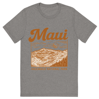 Front view of a Premium Tri-Blend Crew Neck T-Shirt in Grey showing 'A typographic, nostalgic graphic of a typographic illustration of the words 'maui' with a vintage line art drawing of haleakalā national park'