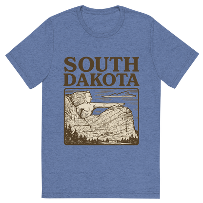 Front view of a Premium Tri-Blend Crew Neck T-Shirt in Blue showing 'A typographic, nostalgic graphic of a typographic illustration of the words 'south dakota' with a vintage line art drawing of the crazy horse memorial'
