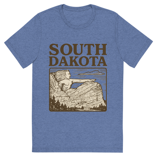 Front view of a Premium Tri-Blend Crew Neck T-Shirt in Blue showing 'A typographic, nostalgic graphic of a typographic illustration of the words 'south dakota' with a vintage line art drawing of the crazy horse memorial'