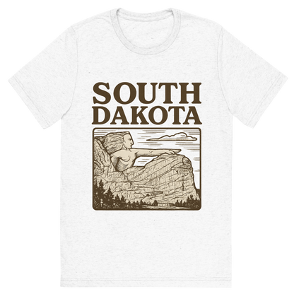 Front view of a Premium Tri-Blend Crew Neck T-Shirt in Solid White showing 'A typographic, nostalgic graphic of a typographic illustration of the words 'south dakota' with a vintage line art drawing of the crazy horse memorial'
