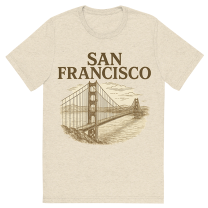 Front view of a Premium Tri-Blend Crew Neck T-Shirt in Oatmeal showing 'A typographic, nostalgic graphic of a typographic illustration of the words 'san francisco' with a vintage line art drawing of the golden gate bridge'