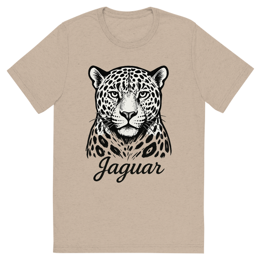 Front view of a Premium Tri-Blend Crew Neck T-Shirt in Tan showing 'A flat, neutral graphic of a bold sketch of a jaguar with large rosettes and strong jawline. “jaguar” appears in elegant script below. detailed ink illustration on a white background.'