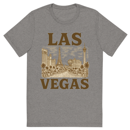 Front view of a Premium Tri-Blend Crew Neck T-Shirt in Grey showing 'A typographic, nostalgic graphic of a typographic illustration of the words 'las vegas' with a vintage line art drawing of the strip'