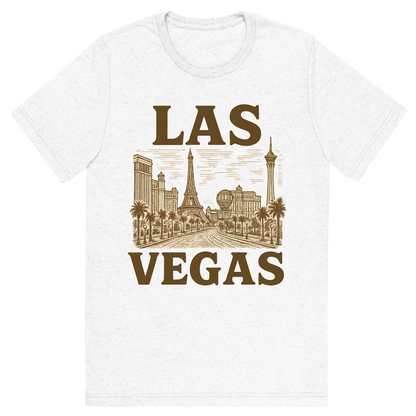 Front view of a Premium Tri-Blend Crew Neck T-Shirt in Solid White showing 'A typographic, nostalgic graphic of a typographic illustration of the words 'las vegas' with a vintage line art drawing of the strip'