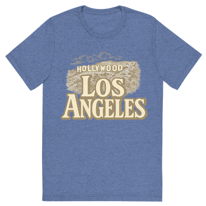 Front view of a Premium Tri-Blend Crew Neck T-Shirt in Blue showing 'A typographic, nostalgic graphic of a typographic illustration of the words 'los angeles' with a vintage line art drawing of the hollywood sign'
