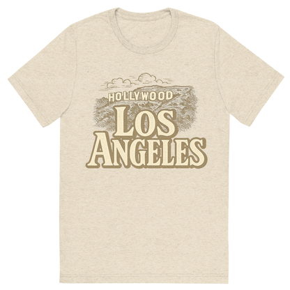 Front view of a Premium Tri-Blend Crew Neck T-Shirt in Oatmeal showing 'A typographic, nostalgic graphic of a typographic illustration of the words 'los angeles' with a vintage line art drawing of the hollywood sign'