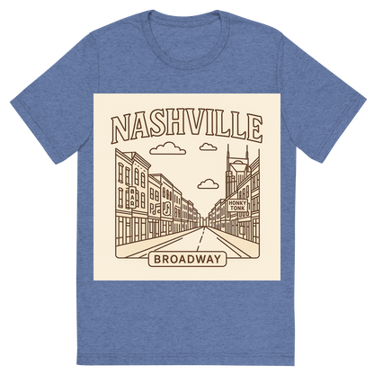 Front view of a Premium Tri-Blend Crew Neck T-Shirt in Blue showing 'A minimalist, playful graphic of a typographic illustration of the words 'nashville' with a vintage line art drawing of broadway street'