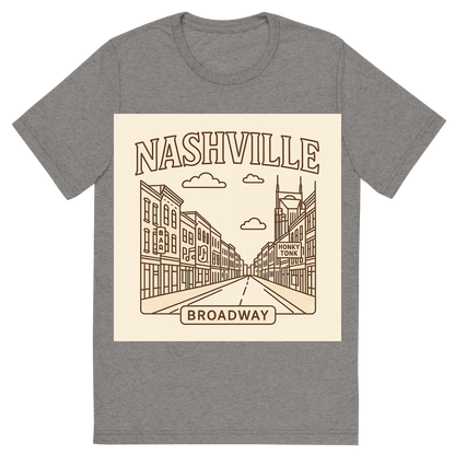 Front view of a Premium Tri-Blend Crew Neck T-Shirt in Grey showing 'A minimalist, playful graphic of a typographic illustration of the words 'nashville' with a vintage line art drawing of broadway street'