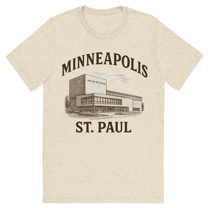 Front view of a Premium Tri-Blend Crew Neck T-Shirt in Oatmeal showing 'A typographic, nostalgic graphic of a typographic illustration of the words 'minneapolis-st. paul' with a vintage line art drawing of the walker art center'