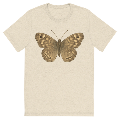 Front view of a Premium Tri-Blend Crew Neck T-Shirt in Oatmeal showing 'A hand-drawn, tranquil graphic of speckled wood butterfly'