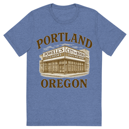 Front view of a Premium Tri-Blend Crew Neck T-Shirt in Blue showing 'A typographic, nostalgic graphic of a typographic illustration of the words 'portland, oregon' with a vintage line art drawing of powell’s city of books'