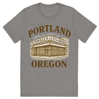 Front view of a Premium Tri-Blend Crew Neck T-Shirt in Grey showing 'A typographic, nostalgic graphic of a typographic illustration of the words 'portland, oregon' with a vintage line art drawing of powell’s city of books'