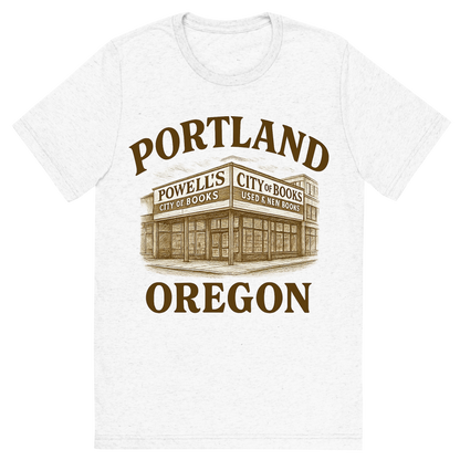 Front view of a Premium Tri-Blend Crew Neck T-Shirt in Solid White showing 'A typographic, nostalgic graphic of a typographic illustration of the words 'portland, oregon' with a vintage line art drawing of powell’s city of books'