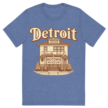 Front view of a Premium Tri-Blend Crew Neck T-Shirt in Blue showing 'A typographic, nostalgic graphic of a typographic illustration of the words 'detroit' with a vintage line art drawing of the motown museum'