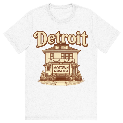 Front view of a Premium Tri-Blend Crew Neck T-Shirt in Solid White showing 'A typographic, nostalgic graphic of a typographic illustration of the words 'detroit' with a vintage line art drawing of the motown museum'
