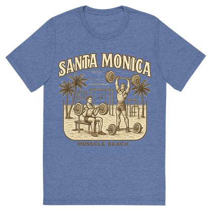 Front view of a Premium Tri-Blend Crew Neck T-Shirt in Blue showing 'A typographic, nostalgic graphic of a typographic illustration of the words 'santa monica' with a vintage line art drawing of muscle beach'