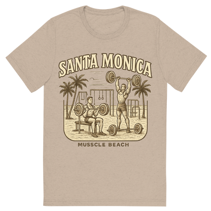 Front view of a Premium Tri-Blend Crew Neck T-Shirt in Tan showing 'A typographic, nostalgic graphic of a typographic illustration of the words 'santa monica' with a vintage line art drawing of muscle beach'