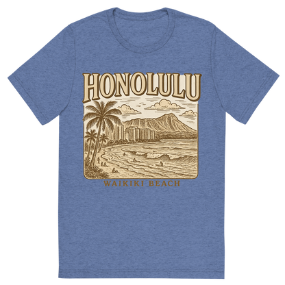 Front view of a Premium Tri-Blend Crew Neck T-Shirt in Blue showing 'A typographic, nostalgic graphic of a typographic illustration of the words 'honolulu' with a vintage line art drawing of waikiki beach'