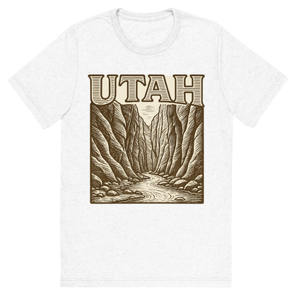 Front view of a Premium Tri-Blend Crew Neck T-Shirt in Solid White showing 'A typographic, nostalgic graphic of a typographic illustration of the words 'utah' with a vintage line art drawing of the the narrows'