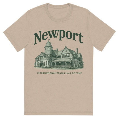 Front view of a Premium Tri-Blend Crew Neck T-Shirt in Tan showing 'A typographic, nostalgic graphic of a typographic illustration of the words 'newport' with a vintage line art drawing of the international tennis hall of fame'