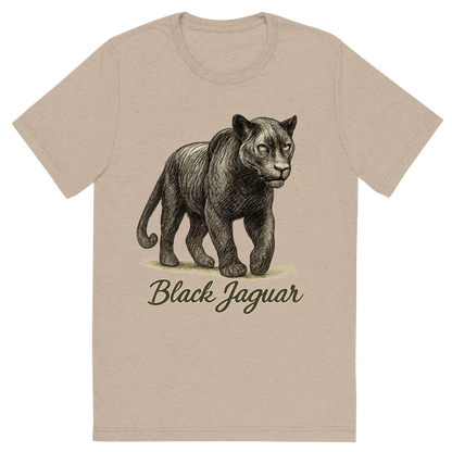Front view of a Premium Tri-Blend Crew Neck T-Shirt in Tan showing 'A flat, neutral graphic of a powerful sketch of a black jaguar with subtle rosettes and shadowy features. “black jaguar” is written in flowing script below. detailed ink illustration on a white background.'