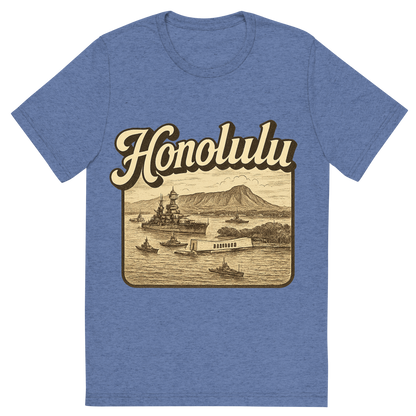 Front view of a Premium Tri-Blend Crew Neck T-Shirt in Blue showing 'A typographic, nostalgic graphic of a typographic illustration of the words 'honolulu' with a vintage line art drawing of pearl harbor'