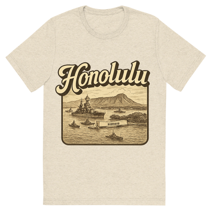 Front view of a Premium Tri-Blend Crew Neck T-Shirt in Oatmeal showing 'A typographic, nostalgic graphic of a typographic illustration of the words 'honolulu' with a vintage line art drawing of pearl harbor'