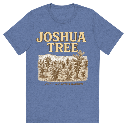 Front view of a Premium Tri-Blend Crew Neck T-Shirt in Blue showing 'A typographic, nostalgic graphic of a typographic illustration of the words 'joshua tree' with a vintage line art drawing of the cholla cactus garden'