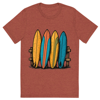 Front view of a Premium Tri-Blend Crew Neck T-Shirt in Clay showing 'A hand-drawn ink with pops of color, playful graphic of a stylized stack of colorful vintage surfboards leaning against a wooden fence, hand-drawn ink with pops of color, centered composition, transparent background, optimized for dtg printing'