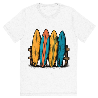 Front view of a Premium Tri-Blend Crew Neck T-Shirt in Solid White showing 'A hand-drawn ink with pops of color, playful graphic of a stylized stack of colorful vintage surfboards leaning against a wooden fence, hand-drawn ink with pops of color, centered composition, transparent background, optimized for dtg printing'