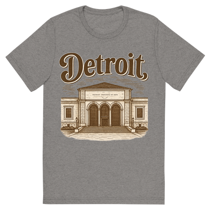 Front view of a Premium Tri-Blend Crew Neck T-Shirt in Grey showing 'A typographic, nostalgic graphic of a typographic illustration of the words 'detroit' with a vintage line art drawing of the detroit institute of arts'