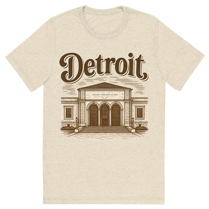 Front view of a Premium Tri-Blend Crew Neck T-Shirt in Oatmeal showing 'A typographic, nostalgic graphic of a typographic illustration of the words 'detroit' with a vintage line art drawing of the detroit institute of arts'
