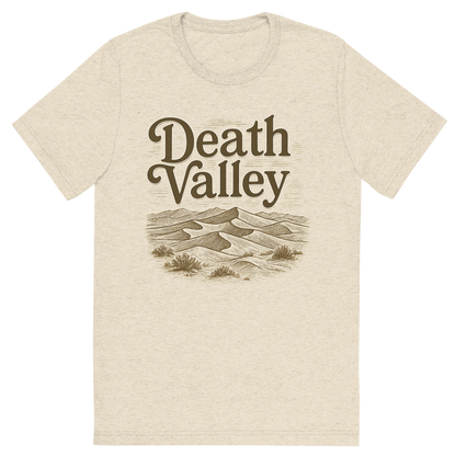 Front view of a Premium Tri-Blend Crew Neck T-Shirt in Oatmeal showing 'A typographic, nostalgic graphic of a typographic illustration of the words 'death valley' with a vintage line art drawing of the mesquite flat sand dunes'