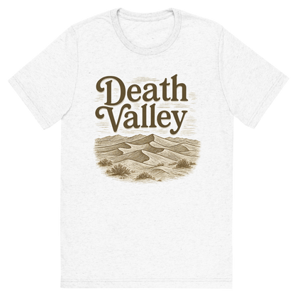Front view of a Premium Tri-Blend Crew Neck T-Shirt in Solid White showing 'A typographic, nostalgic graphic of a typographic illustration of the words 'death valley' with a vintage line art drawing of the mesquite flat sand dunes'