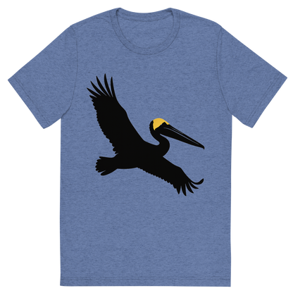 Front view of a Premium Tri-Blend Crew Neck T-Shirt in Blue showing 'A high-contrast silhouette with minimal accent color, majestic graphic of a large silhouette of a brown pelican gliding with wings stretched and pouch visible, yellow crown highlighted in color, transparent background, optimized for dtg printing'