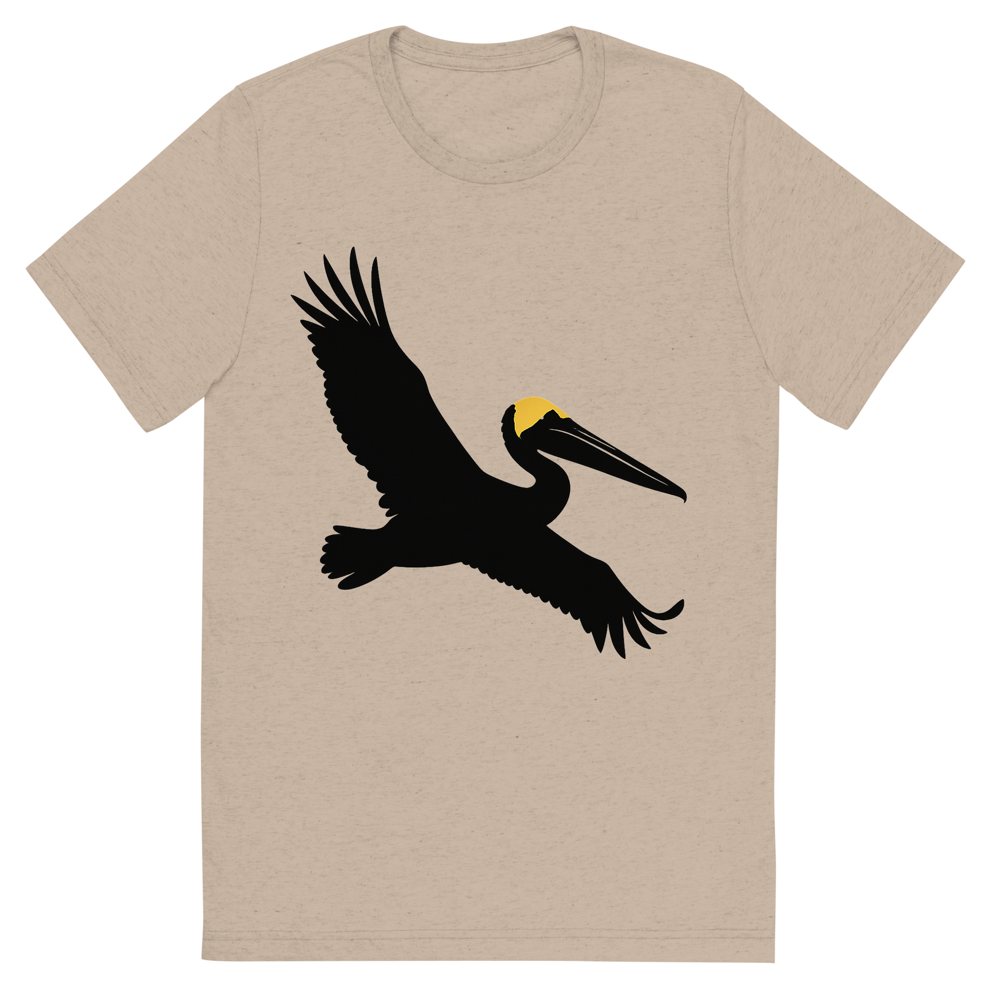 Front view of a Premium Tri-Blend Crew Neck T-Shirt in Tan showing 'A high-contrast silhouette with minimal accent color, majestic graphic of a large silhouette of a brown pelican gliding with wings stretched and pouch visible, yellow crown highlighted in color, transparent background, optimized for dtg printing'