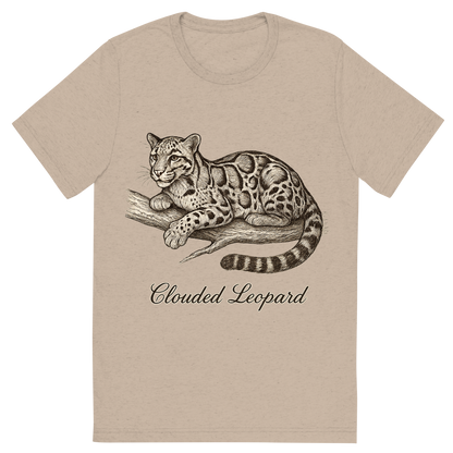 Front view of a Premium Tri-Blend Crew Neck T-Shirt in Tan showing 'A flat, neutral graphic of a graceful sketch of a clouded leopard resting on a branch. “clouded leopard” appears in cursive below. detailed ink illustration on a white background.'