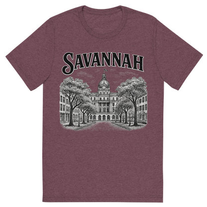 Front view of a Premium Tri-Blend Crew Neck T-Shirt in Maroon showing 'A typographic, nostalgic graphic of a typographic illustration of the words 'savannah' with a vintage line art drawing of the historic district'