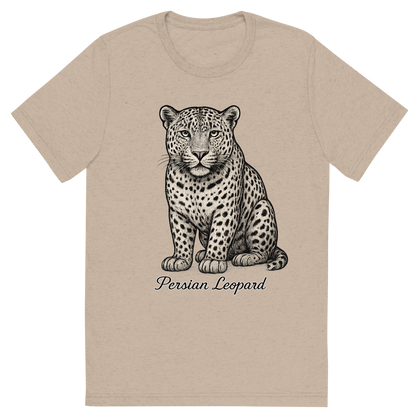 Front view of a Premium Tri-Blend Crew Neck T-Shirt in Tan showing 'A flat, neutral graphic of a fine illustration of a persian leopard with wide head and dense spots. “persian leopard” appears below in graceful cursive. detailed ink illustration on a white background.'