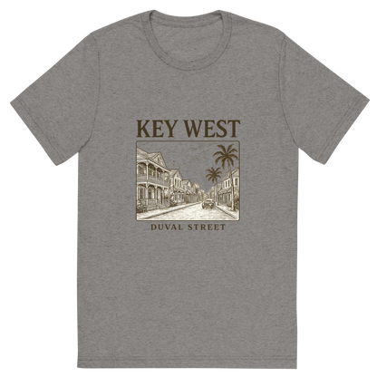 Front view of a Premium Tri-Blend Crew Neck T-Shirt in Grey showing 'A typographic, nostalgic graphic of a typographic illustration of the words 'key west' with a vintage line art drawing of duval street'