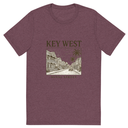 Front view of a Premium Tri-Blend Crew Neck T-Shirt in Maroon showing 'A typographic, nostalgic graphic of a typographic illustration of the words 'key west' with a vintage line art drawing of duval street'