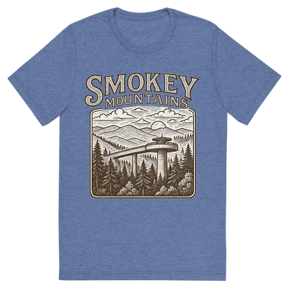 Front view of a Premium Tri-Blend Crew Neck T-Shirt in Blue showing 'A typographic, nostalgic graphic of a typographic illustration of the words 'smokey mountains' with a vintage line art drawing of clingmans dome'
