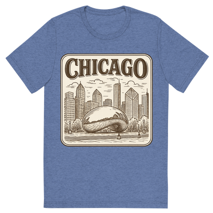 Front view of a Premium Tri-Blend Crew Neck T-Shirt in Blue showing 'A typographic, nostalgic graphic of a typographic illustration of the words 'chicago' with a vintage line art drawing of millennium park'