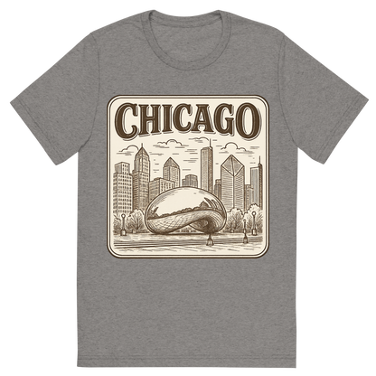 Front view of a Premium Tri-Blend Crew Neck T-Shirt in Grey showing 'A typographic, nostalgic graphic of a typographic illustration of the words 'chicago' with a vintage line art drawing of millennium park'