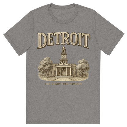 Front view of a Premium Tri-Blend Crew Neck T-Shirt in Grey showing 'A typographic, nostalgic graphic of a typographic illustration of the words 'detroit' with a vintage line art drawing of the the henry ford museum'